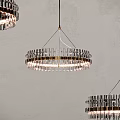 Modern Circular Chandeliers With Crystal And Metallic Frame Hanging In Interior
