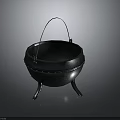 Black Cast Iron Cauldron With Metal Handle And Three Legs Design