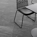Scenic Cafe Outdoor Terrace With Black Chairs Gray Round Stools And Mountain Town View