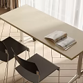 Light Beige Desk With Open Magazine And Black Chairs Near White Curtains On Wooden Floor