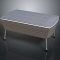 Modern Rattan Side Table With Gray Textured Surface And Slim Metal Legs