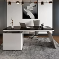 Modern Office Desk With Black Surface White Drawers Laptop Sculpture And Wall Painting