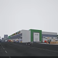 Modern Commercial Street With Shopping Buildings Cars And Blue Sky White Clouds
