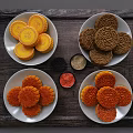 Traditional Assorted Mooncakes on White Plates With Various Fillings and Wooden Tray