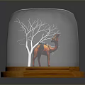 Camel Figurine Inside Glass Dome With Leafless Tree And Sandy Ground On Wooden Base