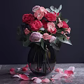 Transparent Glass Vase With Red Pink Roses Green Leaves And Petals On Wooden Table