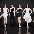 Group of Women in Stylish Black and White Dresses Posing Gracefully on Black Background