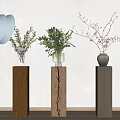 Three Vases Pink Transparent Glass And Gray With Flowers On Wooden Pedestals White Wall
