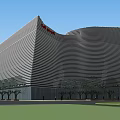 Modern Streamlined Public Building With Curved Metal Facade And Evening Pedestrian Area