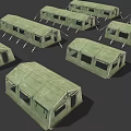 Multiple Green Military Tents In Canvas Material With Ropes And Frames