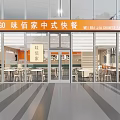 Modern Chinese Fast Food Restaurant With Glass Front Orange Sign Indoor Seating And Wooden Tables