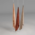 Three Hanging Fabric Textiles In Earthy Tones With Soft Texture And Minimalist Background