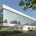 Modern Multi Storey Industrial Factory Building Featuring Glass Curtain Walls And Surrounding Greenery