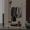 Modern Clothes Rack With Hanging Shirts Dresses Handbag And Decorative Suitcase In Room