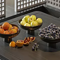 Fresh Various Fruits Including Apples Oranges And Grapes In Bowls On Table