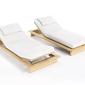 Two Wooden Frame Lounge Chairs With White Cushions For Outdoor Patio Use