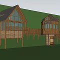 Wooden Cabin Surrounded by Lush Green Forest With Deck Stairs and Gabled Roof