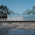 Modern Wheel of Light Feature Wall with Lighting Effects and Tree Reflections