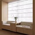 Bay Window With Beige Cushioned Seats Wooden Side Table And Green Plant In White Vase