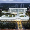 Modern Commercial Complex With Green Roof And Night View