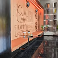 Modern Café Interior Design With Bar Counter Neon Signs Rock Wall Glass Ceiling And Plants
