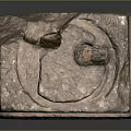 Ancient Stone Pedestal With Carved Texture And Historical Features On Gray Background