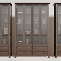 Dark Brown Wooden Bookcases With Glass Doors Drawers And Books Globe Sculptures Vases