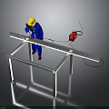 Man wearing blue uniform with yellow safety helmet welding metal frame near red welding machine
