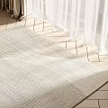 Light Colored Square Rug With Woven Texture On Wooden Floor Near White Curtains