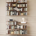 Modern Open Multi tiered Bookshelf Filled With Books Decorative Items And Table Lamp