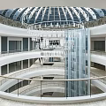 Spacious Modern Shopping Mall Lobby With Multi Level Staircase And Glass Railings