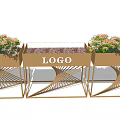Golden Flower Planters with Woven Stands Pink Flowers and Central LOGO