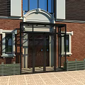 Red Brick Building Entrance With Arched Doorway And Black Glass Porch