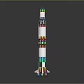 Multi Layered Structure With White Main Body Colorful Rings And Smaller Components Beside