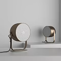 Modern Minimalist Golden Bronze Table Lamps With White Frosted Shades And Metal Stands On White Platform
