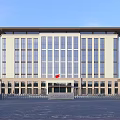 Modern Office Building With Large Glass Windows Light Colored Facade And Spacious Entrance Courtyard