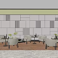 Cozy Casual Lounge Area With Gray Armchairs Round Tables Green Plants And Wooden Details