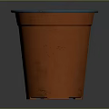 Vibrant Orange Garden Flower Pot With Blue Rim And Fresh Soil Inside