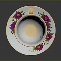 Porcelain Teacup and Saucer with Colorful Floral Patterns and Gold Rim