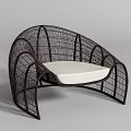 Modern Rattan Outdoor Chair with Curved Design and Comfortable White Cushion