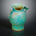 Antique Turquoise Ceramic Jug With Handles Spout And Speckled Texture On Dark Background