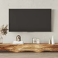 Wooden TV Stand with Unique Natural Edge Design and Decorative Items Under Wall Mounted TV