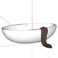 Modern Freestanding White Oval Bathtub With Brown Towel On Dark Background