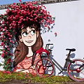 Charming Photo Check-in Spot With Girl Mural Red Flowers And Bicycle