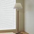 Beige Lampshade Floor Lamp With Wooden Pole By Window With Blinds And Light Colored Wall