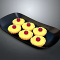 Six Delicious Yellow Tarts Topped With Red Cherries On Black Plate