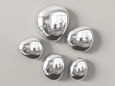 Shiny Silver Teardrop Shaped Wall Decor Arranged on Grey Wall 3d model