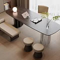 Modern Oval Black Table With Beige Chair Bench Stools Laptop Magazine And Green Plant