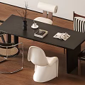 Modern Dining Table Set With Dark Surface And Mixed Design Chairs On Wooden Floor