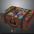 Vintage Brown Suitcase Decorated With Colorful Travel Stickers And Leather Handle
